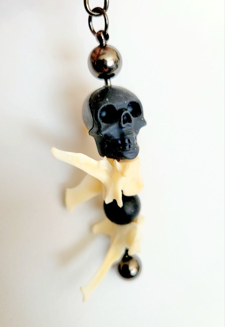 skull bone hanging, art by Sherrie Thai of Shaireproductions.com