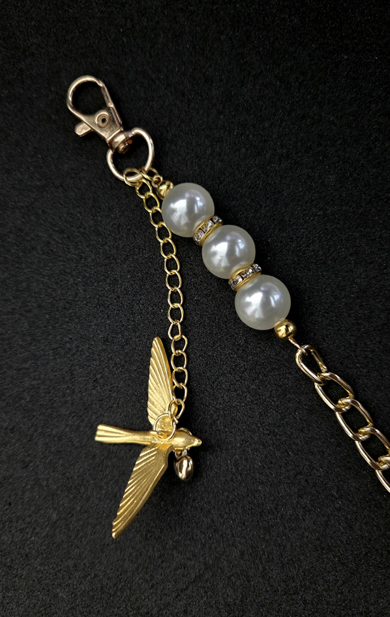 gold bird bag chain, art by sherrie thai of shaireproductions