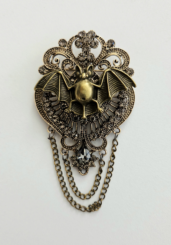 bronze bat brooch, art by sherrie thai of shaireproductions